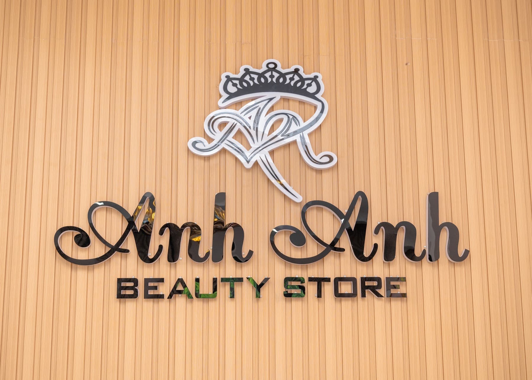 The Anh Anh Beauty Store sign on a wooden wall