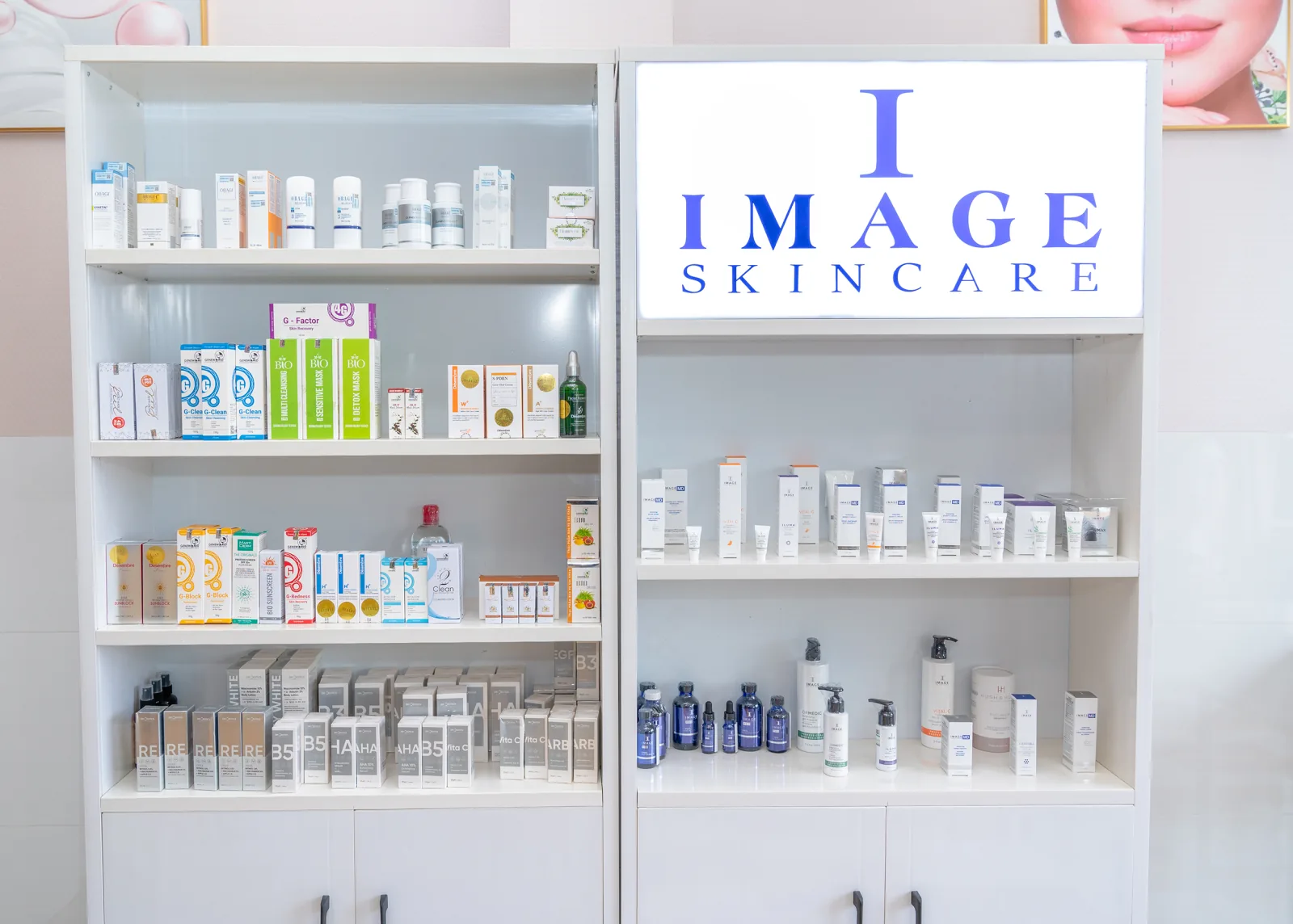 Skin-care boxes on white shelves beside an IMAGE sign